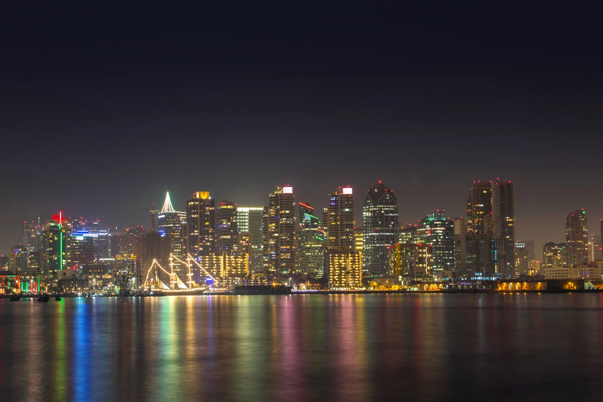 San Diego downtown skyline at night with city lights reflected on the bay